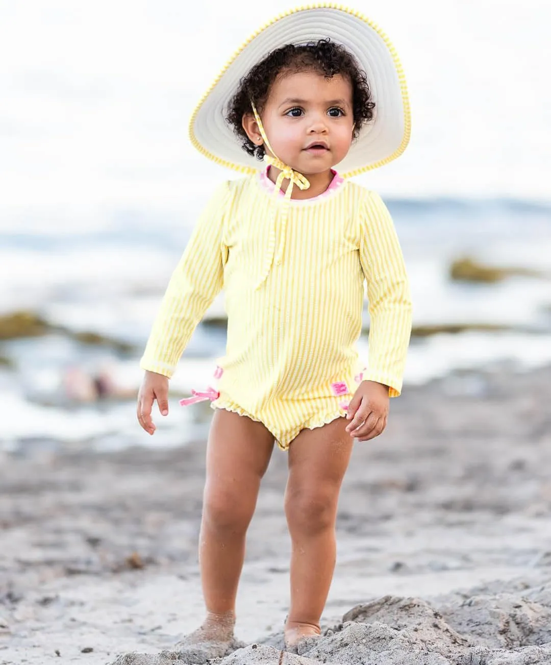 RuffleButts Baby/Toddler Girls Seersucker Long Sleeve One Piece Rash Guard Swimsuit with UPF 50  Sun Protection